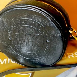 Michael Kors Fulton Logo Debossed Leather canteen crossbody bag.